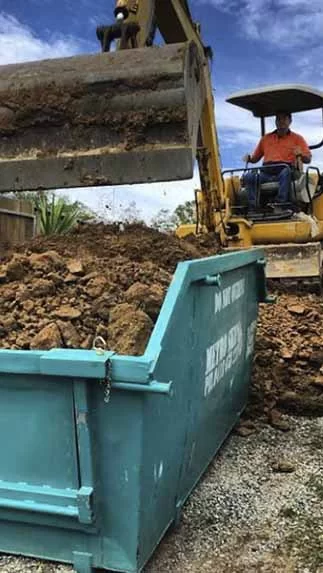 Skip bin being filled at a residential property